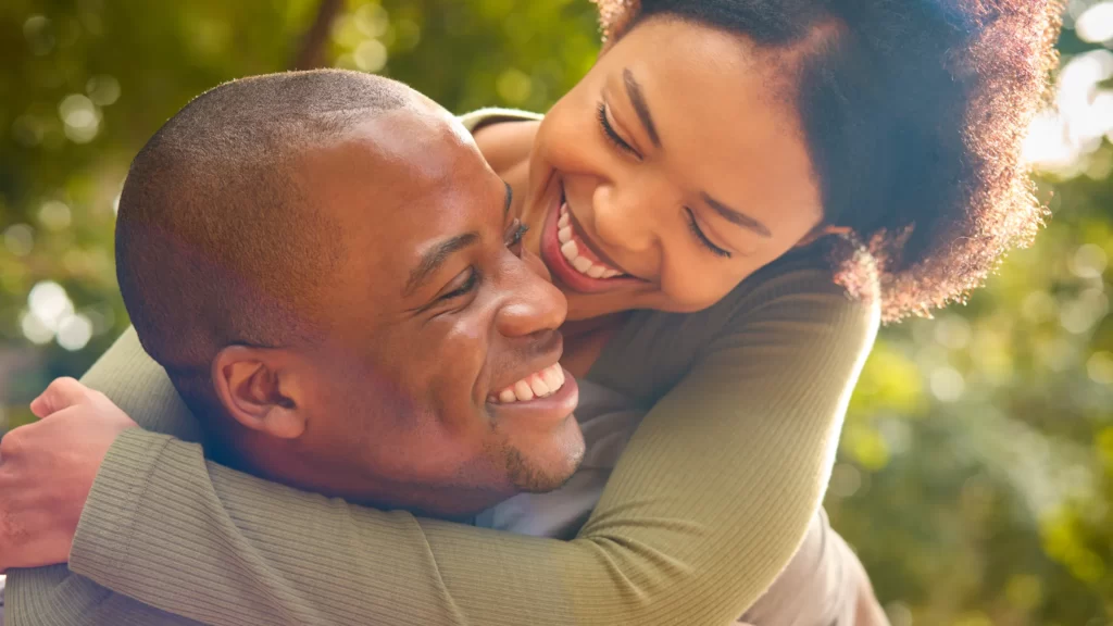 loving couple hugging outdoors in countryside or g utc